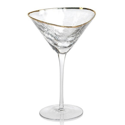 The Hammered Gold Rim Martini Glass has a clear textured pattern with gleaming gold rim that's sure to glam up any party. Boasting a simple yet elegant design, this glass is certain to bring eclectic style to any occasion. Great for serving, this glass is a versatile addition to your glassware collection.