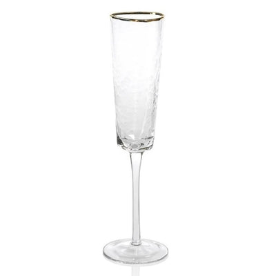 The Hammered Gold Rim Champagne Flute on Stem has a clear textured pattern with gleaming gold rim that's sure to glam up any party. Boasting a simple yet elegant design, this glass is certain to bring eclectic style to any occasion. Great for serving a variety of champagne, this flute is a versatile addition to your glassware collection.