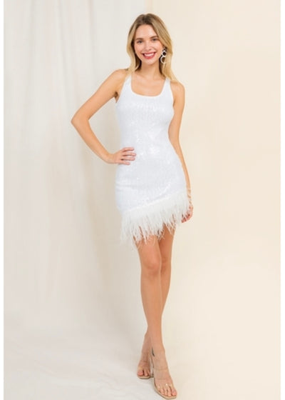 This White Sequin Mini dress is the ultimate show-stopping, party dress to dance you through the night. Featuring all-over intricate beadwork with a flirty feather asymmetric hemline you will make an entrance wearing her. 