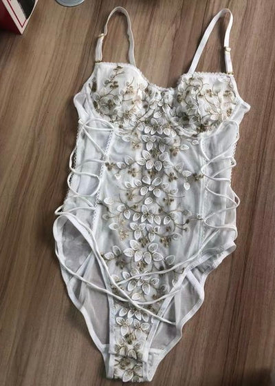 The White Flower Embroidered Bodysuit features lace up sides to contour your waist just right! Add this sophisticated bodysuit to your nighttime routine to feel beautiful! 