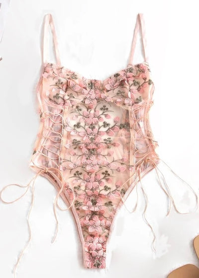 The Peach Embroidered Floral Bodysuit features lace up sides and adjustable straps to give you a perfect fit! The mesh background gives a flirty flare for the gorgeous embroidery work!