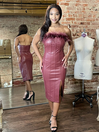 You will stand out in the Scarlet Pleather Midi Dress featuring a feather neckline! This party perfect dress had a flirty front slit.  The soft stretchy pleather creates that poured in look! The feather trim is fully detachable making this dress so versatile.  Pair with a denim jacket and boots for a more casual look.