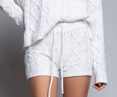 The White Fleece Cable Knit Sleep Shorts are both comfy and cute! The soft Berber fleece is knitted in a pattern resembling your favorite cable sweater.  The draw string waist allows a great fit! Pair with our bralettes for a perfect look!  Sleep Shorts only.