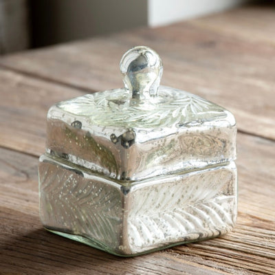 This Mercury Glass Ring Box is the perfect size to hold rings or heirlooms, and it will look stunning on a vanity.  Item Dimensions: 3.5"L x 3.5"W x 4.75"H