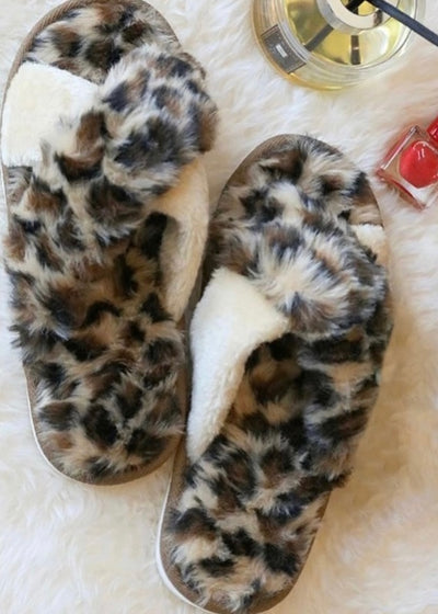 Be super comfy and stylish in our Leopard House Slippers!  Covered in faux fur and softly padded, these slides will keep you warm!  Pair with our Cream Leopard Robe, and our Leopard Cosmetic Bag for the complete look!  Sold seperately.