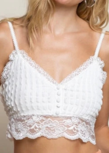 This White Lace Button Bralette is the perfect piece to add an adorable touch to an outfit.