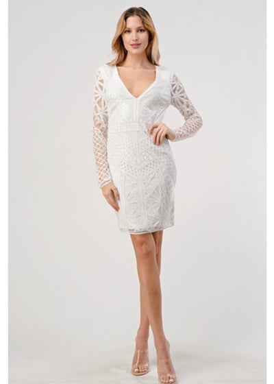The White Long Sleeve Sequin Mini Dress will always take first place in our hearts! Lightweight mesh fabric, decorated with a beaded and sequined pattern (and with a matching knit liner) shapes a plunging V-neckline with a sheer mesh insert, and features long sleeves. Banded waist tops a figure-skimming skirt that falls to a mini hem.