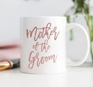 The “Mother of the Groom” Mug is a sweet way to show appreciation to your soon to be mother in law!  The mug features pink glitter print.