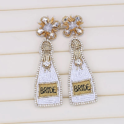 The Champagne Bottle Beaded Bride Earrings are handcrafted featuring high-quality gemstones and 14k gold plated posts. Whether you're planning a bridal shower or bachelorette party, this is the new must-have for any or all bridal events!