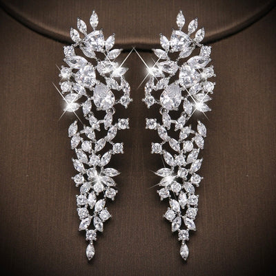 These Rhinestone Vine & Leaf Earrings are super cute drape earrings that will add just the perfect touch to any bridal gown or formal dress! The pattern of vine & leaf create a delicate icy look, and add character to any dress you wear! 