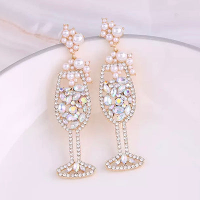 The Bubbly Champagne Glass Earrings are the right amount of shine to any bachelorette weekend or bridal shower. These feature brilliant rhinestone detailing, with faux pearl bubbles! 