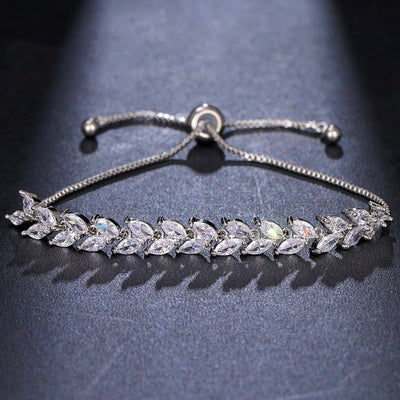 The Rhinestone Charm Leaf Bracelet is a gorgeous silver bracelet perfect for any formal occasion! The beautiful leaf detailing is unique and is sure to add bling to your outfit! This bracelet features a slide bead to tighten or loosen this bracelet. 